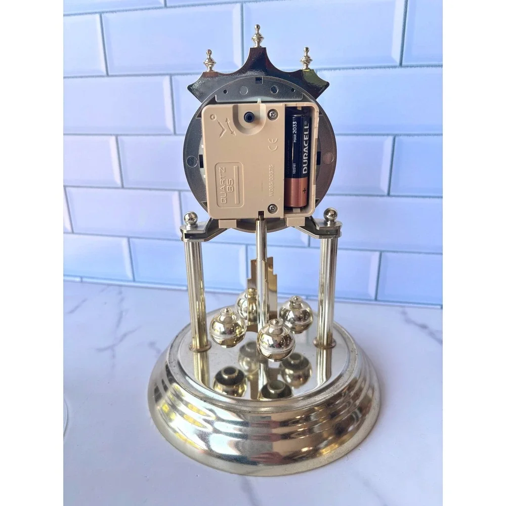Chronos Quartz Anniversary Clock Gold Tone Glass Dome Floral Face Rotating Ball